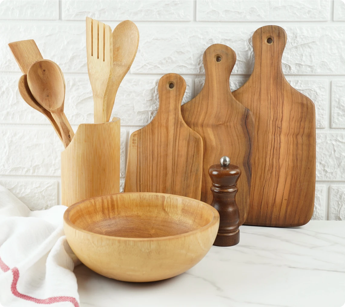 Wooden kitchen utensils on marble countertop